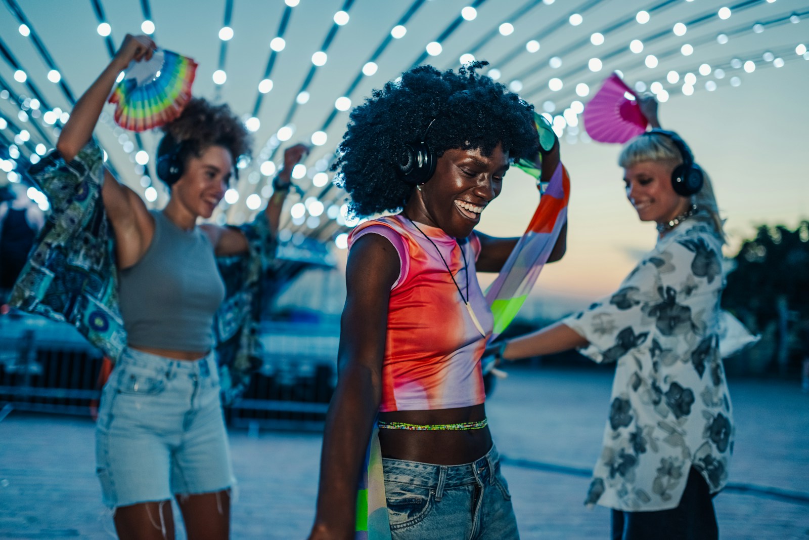 A diverse group of friends dancing together at a silent disco
